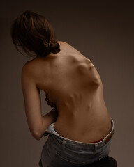 Childhood fears appearing. Human screaming silhouette appearing from female skin on back....