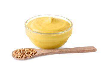 Bowl of delicious mustard and spoon with seeds on white background