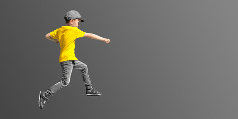 Fototapeta na wymiar a boy jumps on a transparent background in a yellow t-shirt