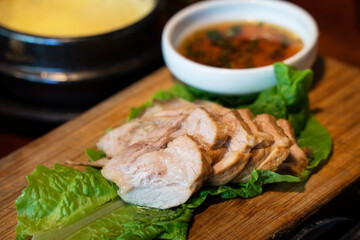 Fresh and delicious iron pan-fried black pork meal in Jeju Korean restaurant.