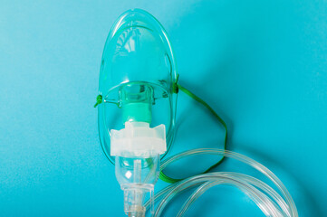 Respiratory mask - treatment of asthma, respiratory tract, bronchitis on the blue background