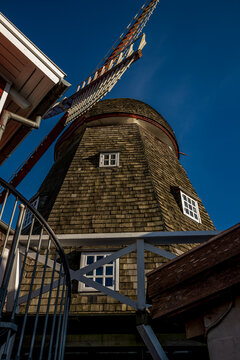 02-04-2023 Skanderborg, Denmark - Corn mil with red wooden building blue sky