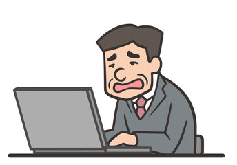 仕事が忙しくて残業する中年の男性社員