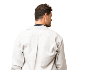 Brazilian man over isolated chroma key background in back position and looking side