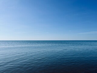 Blue sea horizon, natural seascape background, shining sea surface