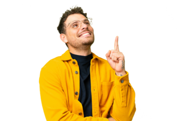 Brazilian man over isolated chroma key background pointing up a great idea