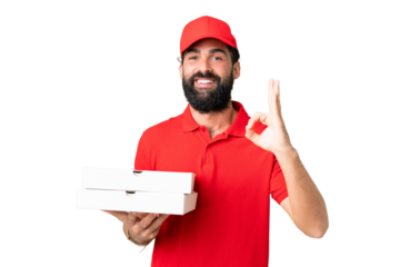 Pizza delivery man with work uniform picking up pizza boxes over isolated chroma key background showing ok sign with fingers
