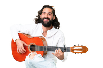 Obraz premium Young man with beard with guitar over isolated chroma key background