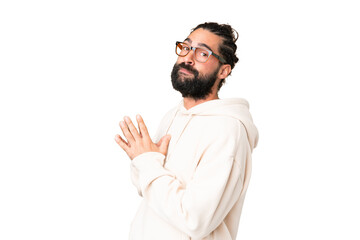 Young man with beard over isolated chroma key background scheming something
