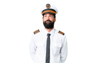 Airplane caucasian pilot man over isolated chroma key background and looking up
