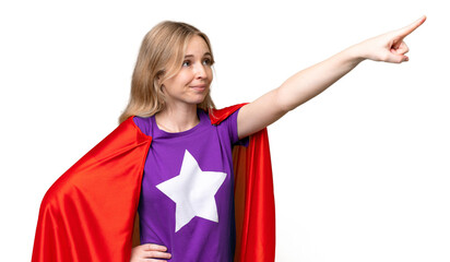 Young English woman over isolated background in superhero costume with proud gesture © luismolinero