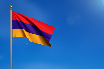 Armenia. Flag blown by the wind with blue sky in the background
