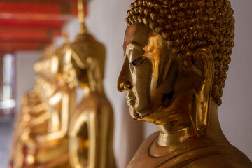 Buddha statues at Wat Po (Wat Pho), Temple of Reclining Buddha popular tourist attraction in...