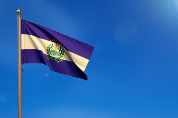 El salvador. Flag blown by the wind with blue sky in the background