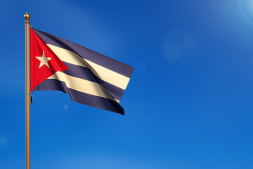 Cuba. Flag blown by the wind with blue sky in the background