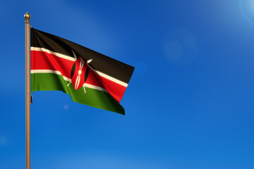 Kenya. Flag blown by the wind with blue sky in the background