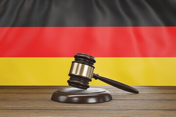 Small hammer gavel of judges of courts placed on a wooden table with the national flag of Germany as background. Illustration of the concept of German legal system and judicial issues - obrazy, fototapety, plakaty