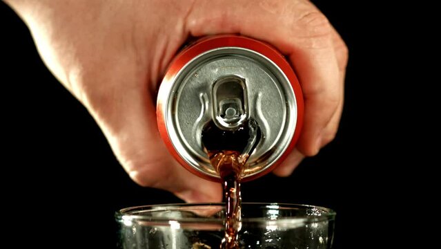 Cola is poured from a can into a glass. Filmed is slow motion 1000 fps. High quality FullHD footage