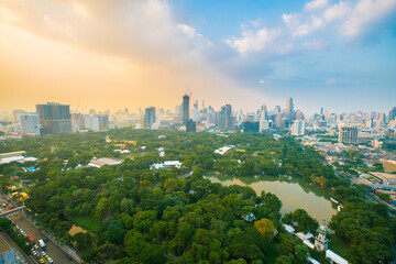 Fototapeta na wymiar Aerial view Bangkok city Lumpini public park with office building urban background