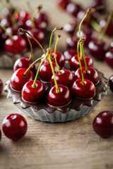chocolate tart with red cherry.
