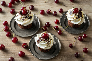 delicious, fresh cupcakes with fresh cherry.