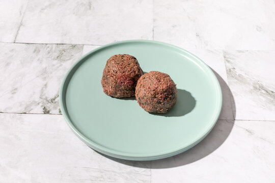Georgian beetroot phali or pkhali with walnuts, garlic and spices on black plate
