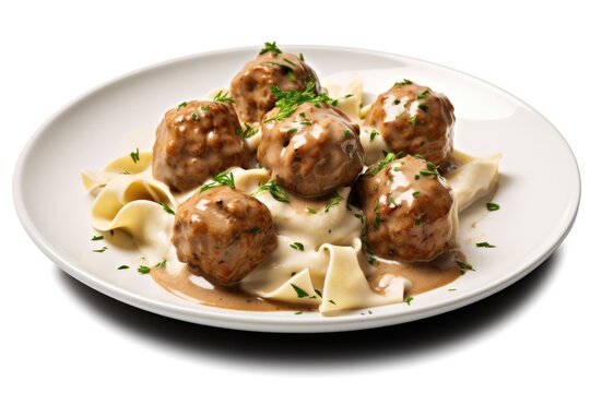 Delicious Plate of Swedish Meatballs with Noodles Isolated on a White Background