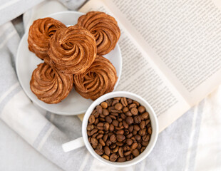 homemade marshmallow zephyr with coffee and caramel.natural ingredients.open book coffee cup.woman hand taking one piece.smiling face from coffee beans.dessert in box, or torn paper, diagonal lines