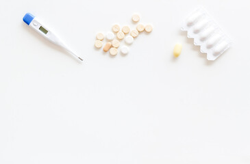 Thermometer with rectal suppositories and pills for medical treatment
