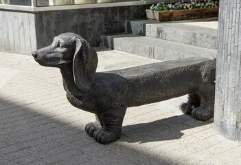 Bronze sculpture of a dachshund in the form of a bench in Sondersborg - Denmark