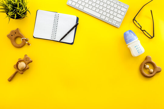 Table Of Young Mother At Home Office - Computer And Kids Toys, Top View