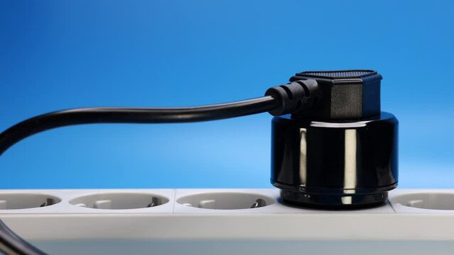 Hand Plugs The Plug With Adapter Into An Extension Cord Socket. 4k, 60 FPS, ProRes.