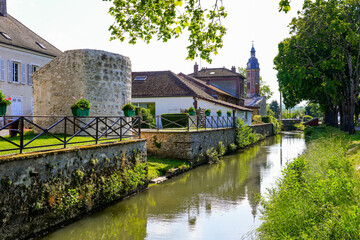Home built next to the ruins of a medieval fortification tower by the Grand Morin river in Crécy...