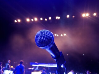Microphone on stage concert music background - 613867602