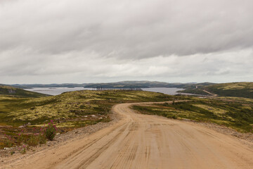 Background on the coast of the Barents Sea. Road