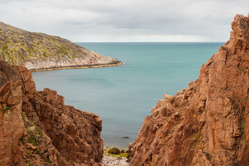 Fototapeta na wymiar Background on the sea coast near Teriberka. The northern sea coast.