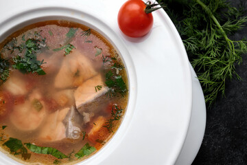 Aromatic red fish soup with tomatoes, garlic and spices