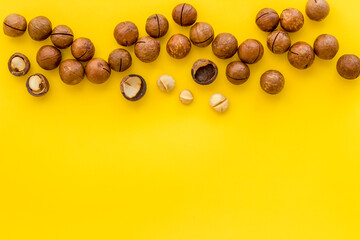 Flat lay of macadamia nuts, top view. Healthy protein food background
