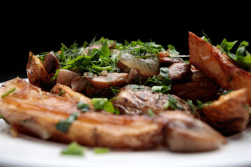 Fried potatoes with mushrooms, onions, herbs, homemade