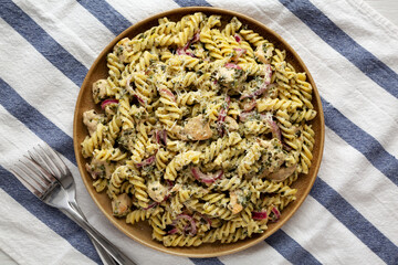 Homemade Creamy Lemon Butter Chicken Pasta on a Plate, top view. Flat lay, from above, overhead.