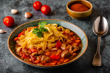 Lagman soup with lamb, homemade noodles and vegetables.
