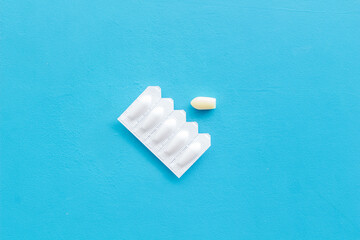 Rectal suppositories in white blister, top view. Pharmaceuticals for medical treatment