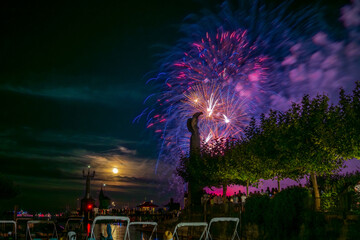 People watching beautiful fireworks at Constance lake night festival photographed from the harbor...