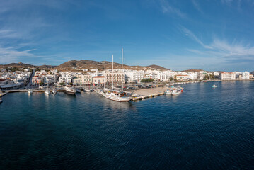 Fototapeta na wymiar Tinos island Hora town Cyclades Greece. Aerial drone view of port, sea, blue sky, summer holiday.