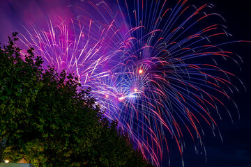 People watching beautiful fireworks at Constance lake night festival photographed from the harbor...
