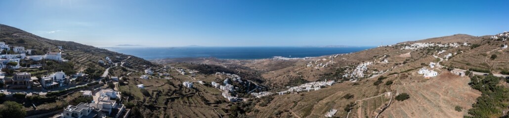 Fototapeta na wymiar Tinos island, Cyclades Greece. Aerial panoramic view. Villages on rocky land