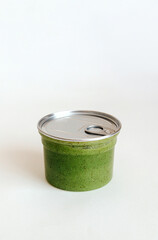 Green Natural Scrub with Sea Salt, Olive oil and Green Tea in Sealed Jar on white