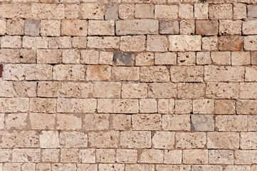 Old brown limestone wall background