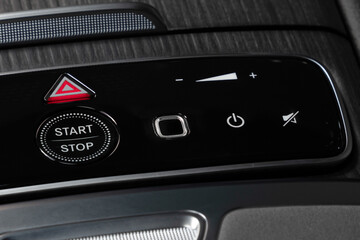 a close up of a start stop control panel in a car