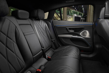 interior of a luxury car with black leather seats